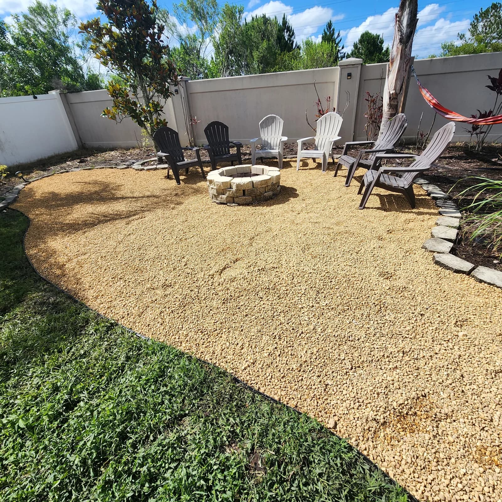 Custom residential backyard with turf and pavers