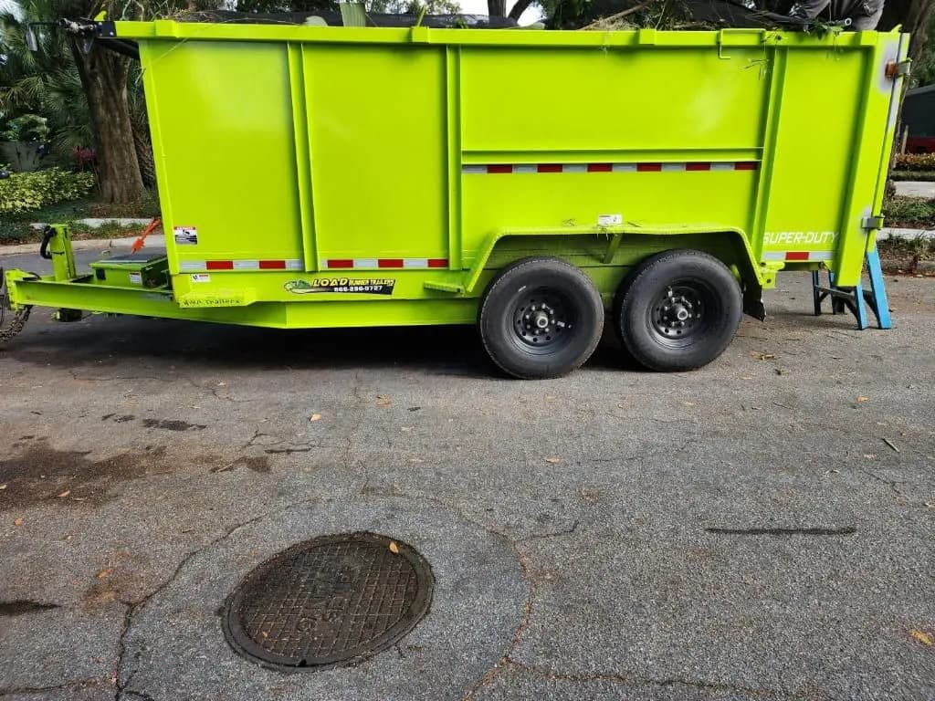 Dump trailer parked in residential driveway